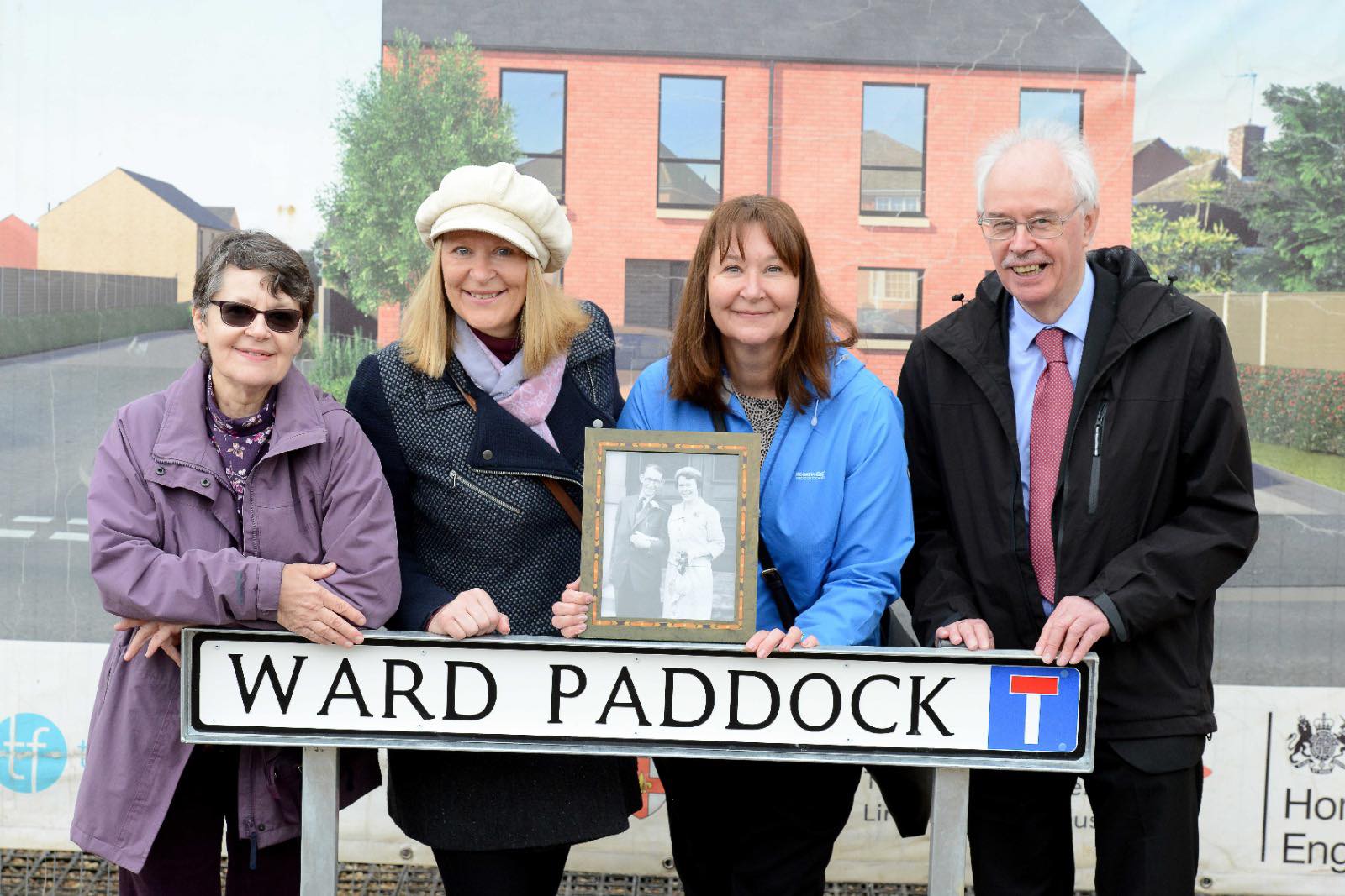 'Ward' sisters and Cllr Nannestad stood with road sign