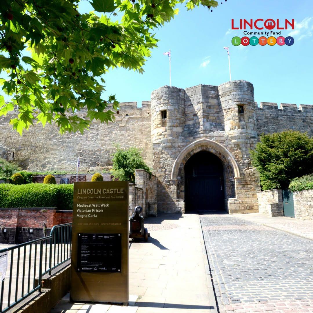 The entrance to Lincoln Castle with the Lincoln Lottery Community Fund logo in the top right corner.