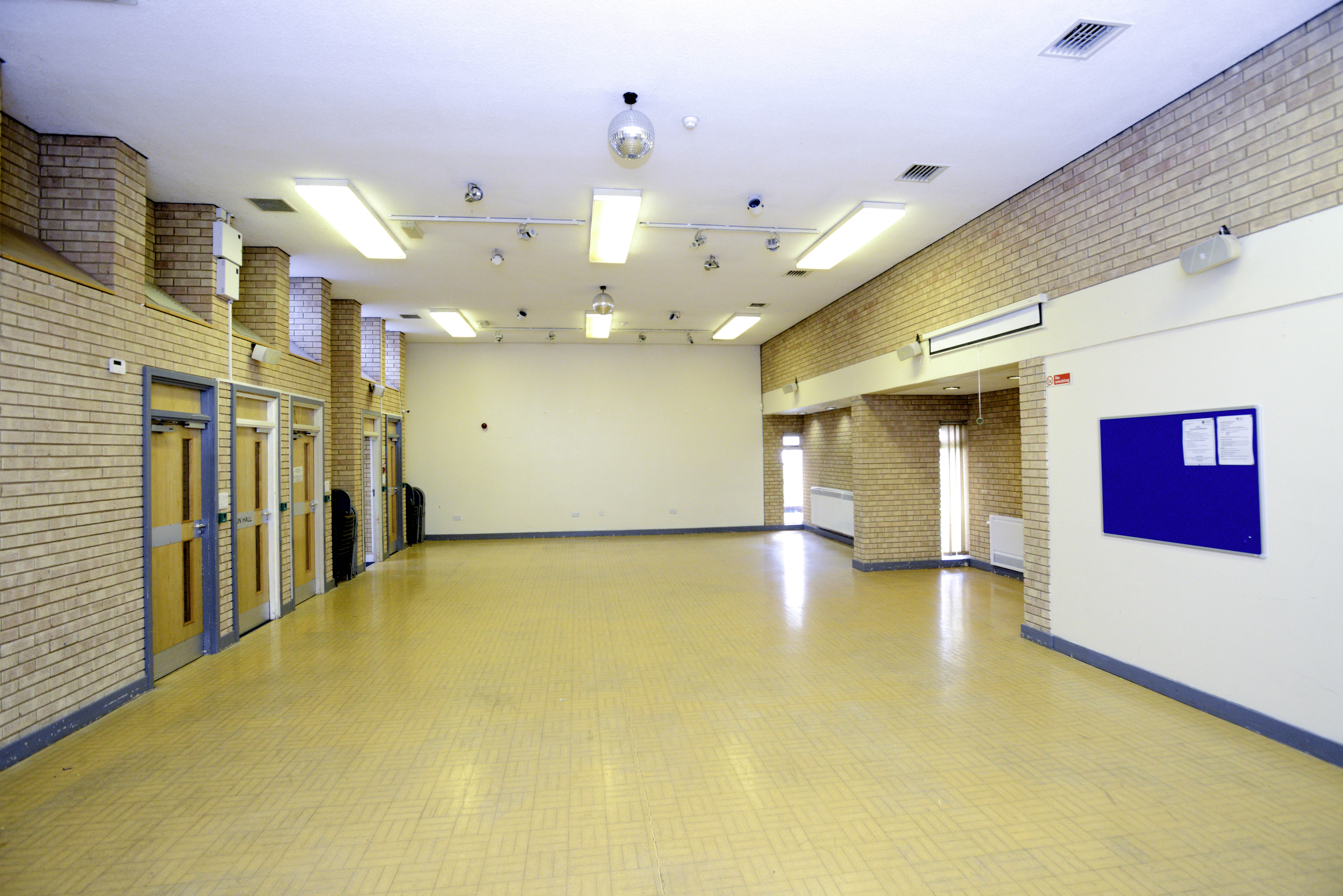 Main Hall, wooden floor and white wall 