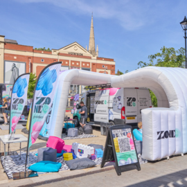 The Zone Go space, with colourful decor, shaded spots and activities.
