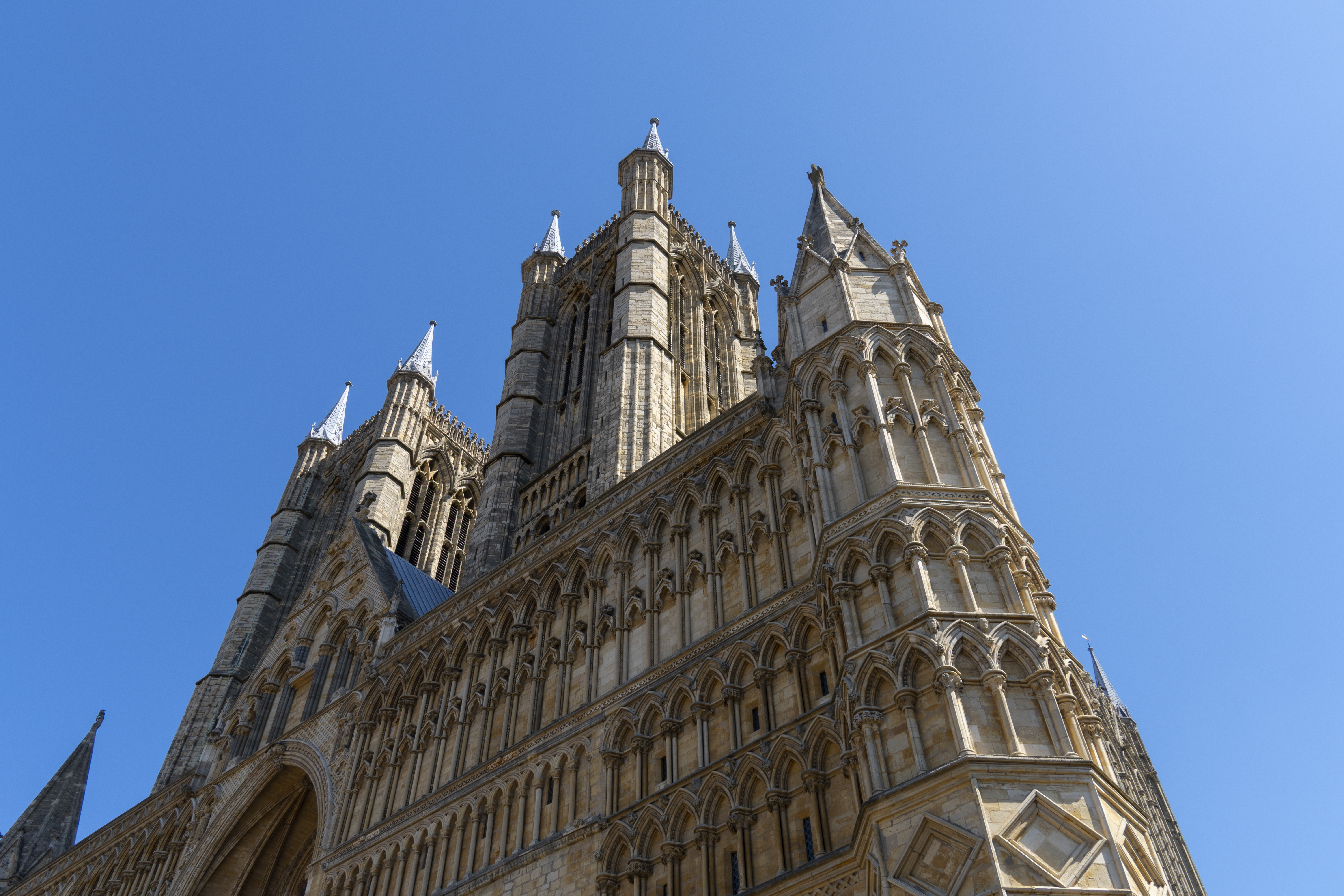 Image of Lincoln Cathedral from beneath in the middle of summer