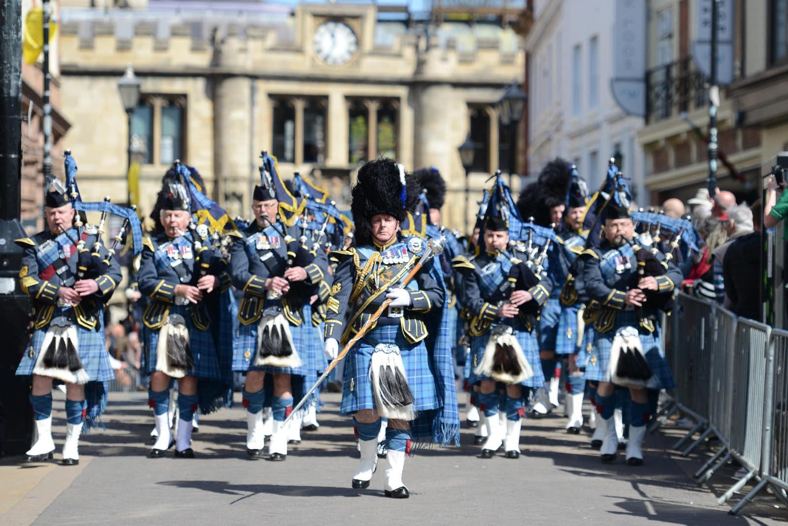 A parade of RAF personnel walking down the high street in Lincoln.