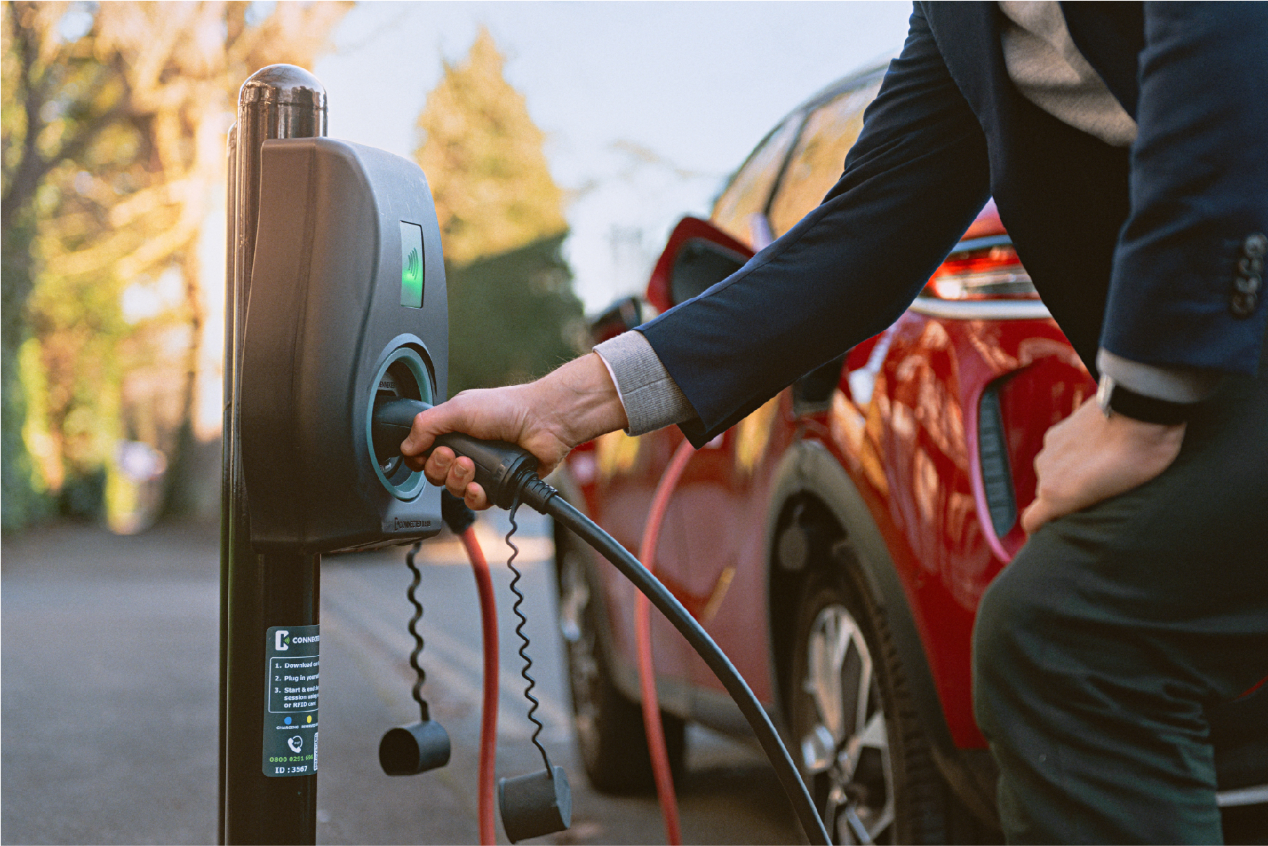 image shows someone using an ev chargepoints