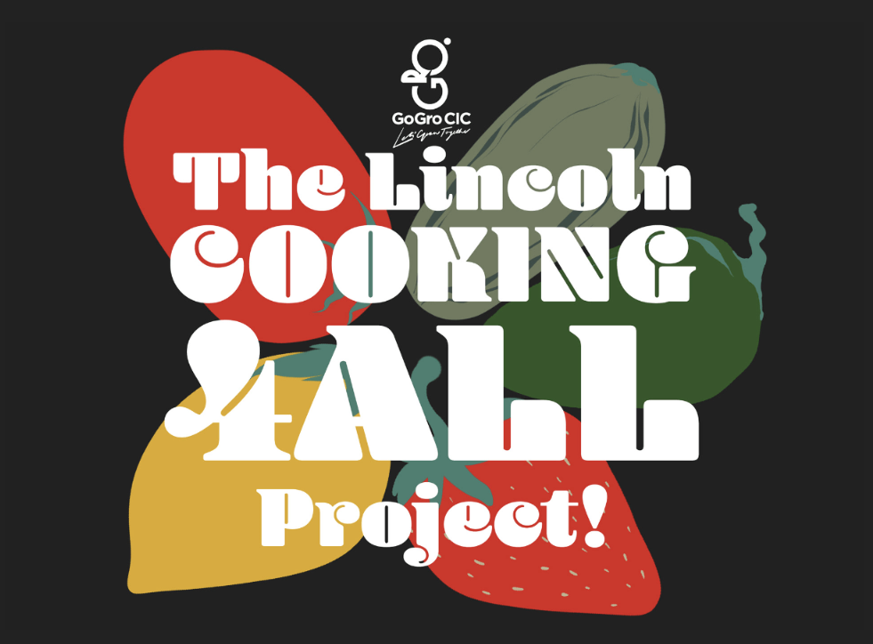 A graphic image of GoGro's Cooking4all logo with colourful fruits in the background.