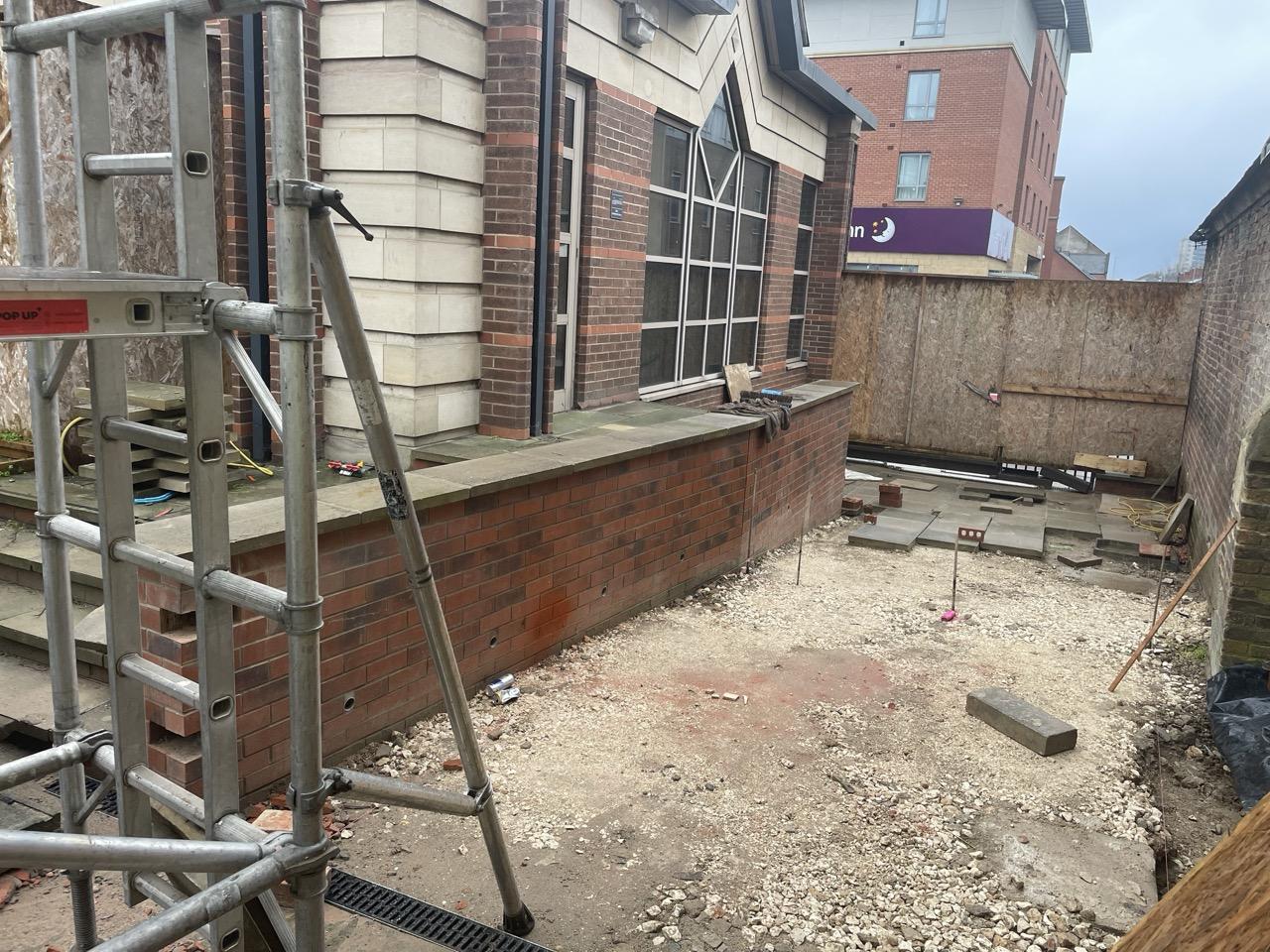 The exterior of the Greyfriars building with scaffolding on works going on around it.