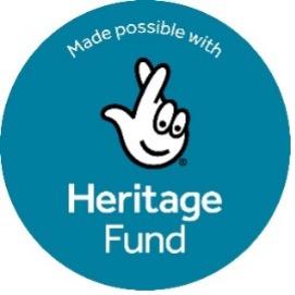 A blue circle with a smiley face cross fingers inside with the text Heritage Fund beneath.