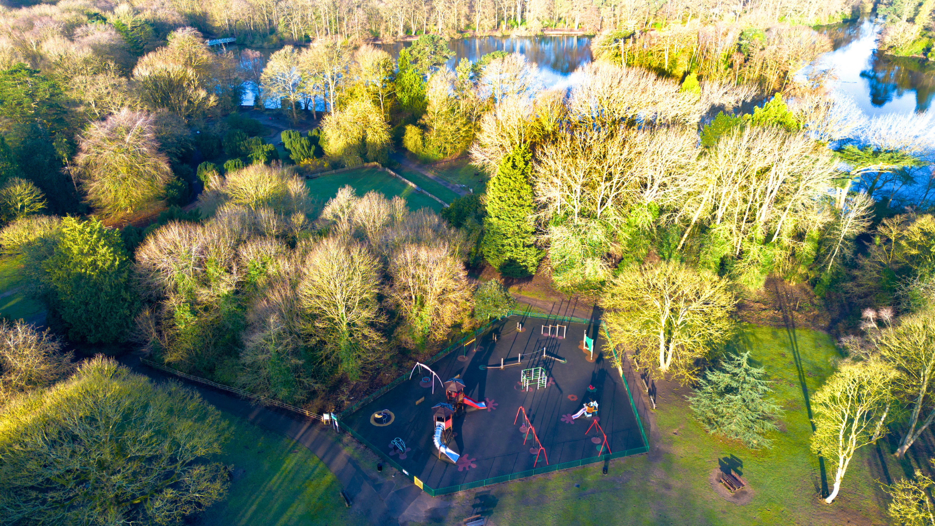 A drone shot looking down on the play area of Hartsholme Country Park in Lincoln.