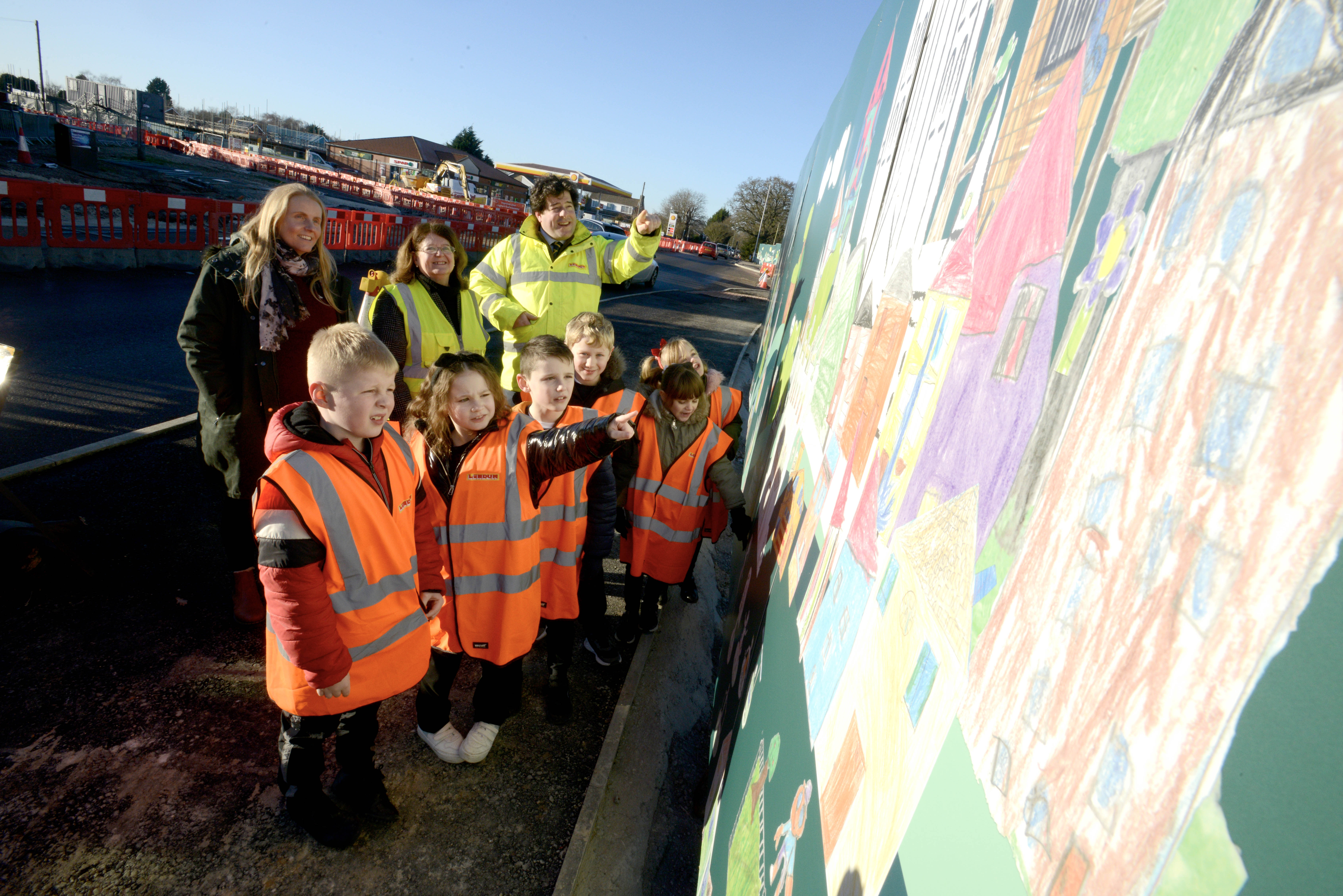 Birchwood Primary School pupils view their artwork close up.