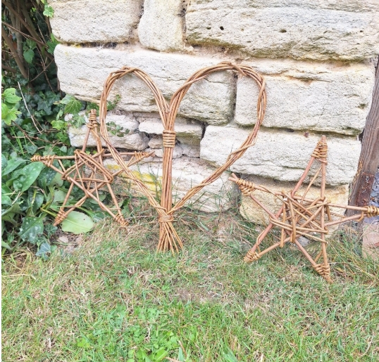 Two stars and a heart made out of woven willow