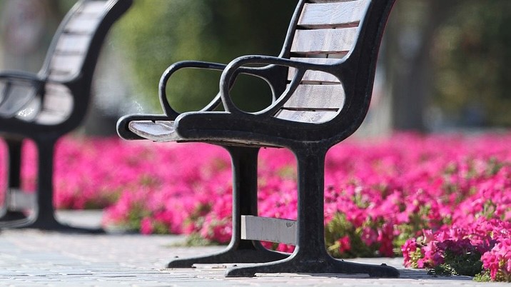 A stock image of an outdoor bench