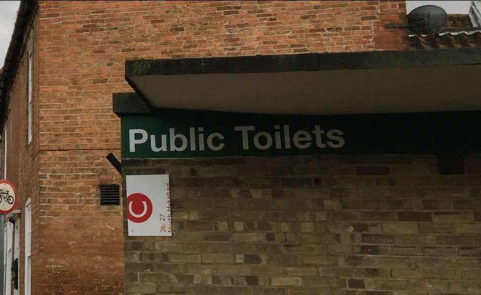 Public Toilets sign image.